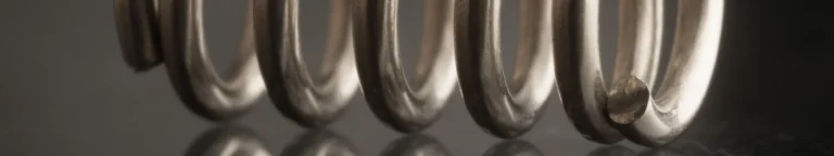 Absaugung von Schleifstaub bei der Herstellung von Druckfedern