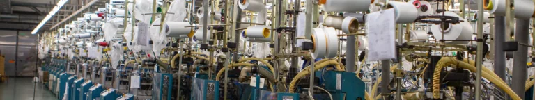 Absaugtechnik zur Erfassung von Textilfasern und feinem Staub in der Textilverarbeitung